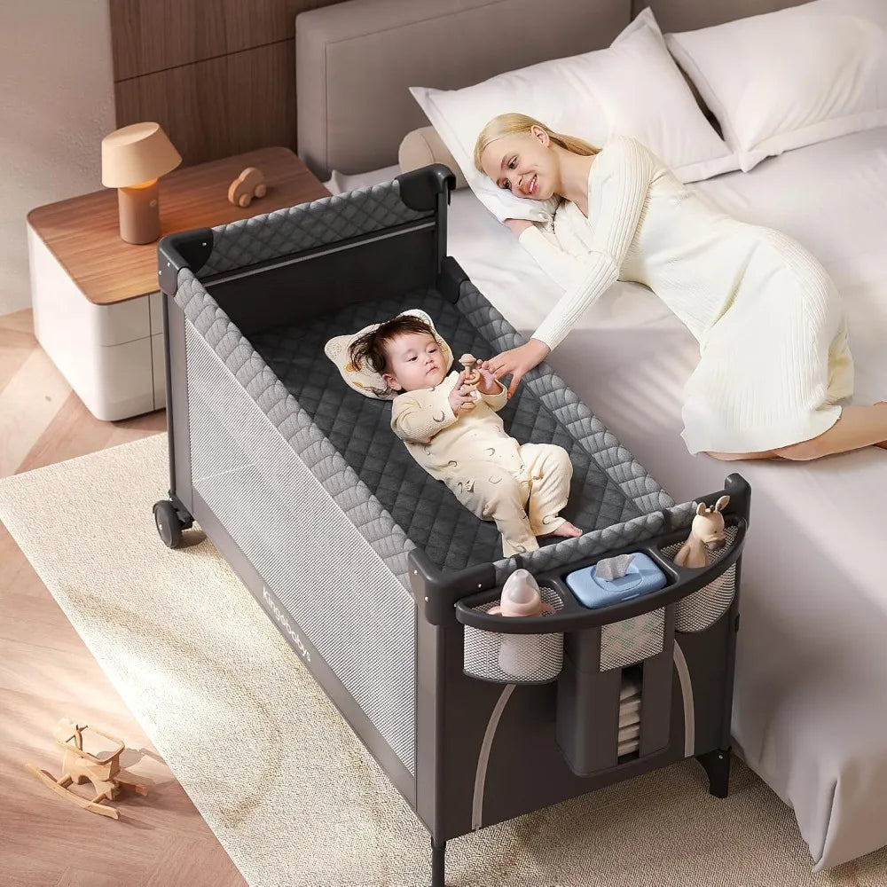 4 In 1 Baby Bassinet Pack and Play Bedside Crib Sleeper with Bottom Storage and Toy Bar for Newborns and Toddlers