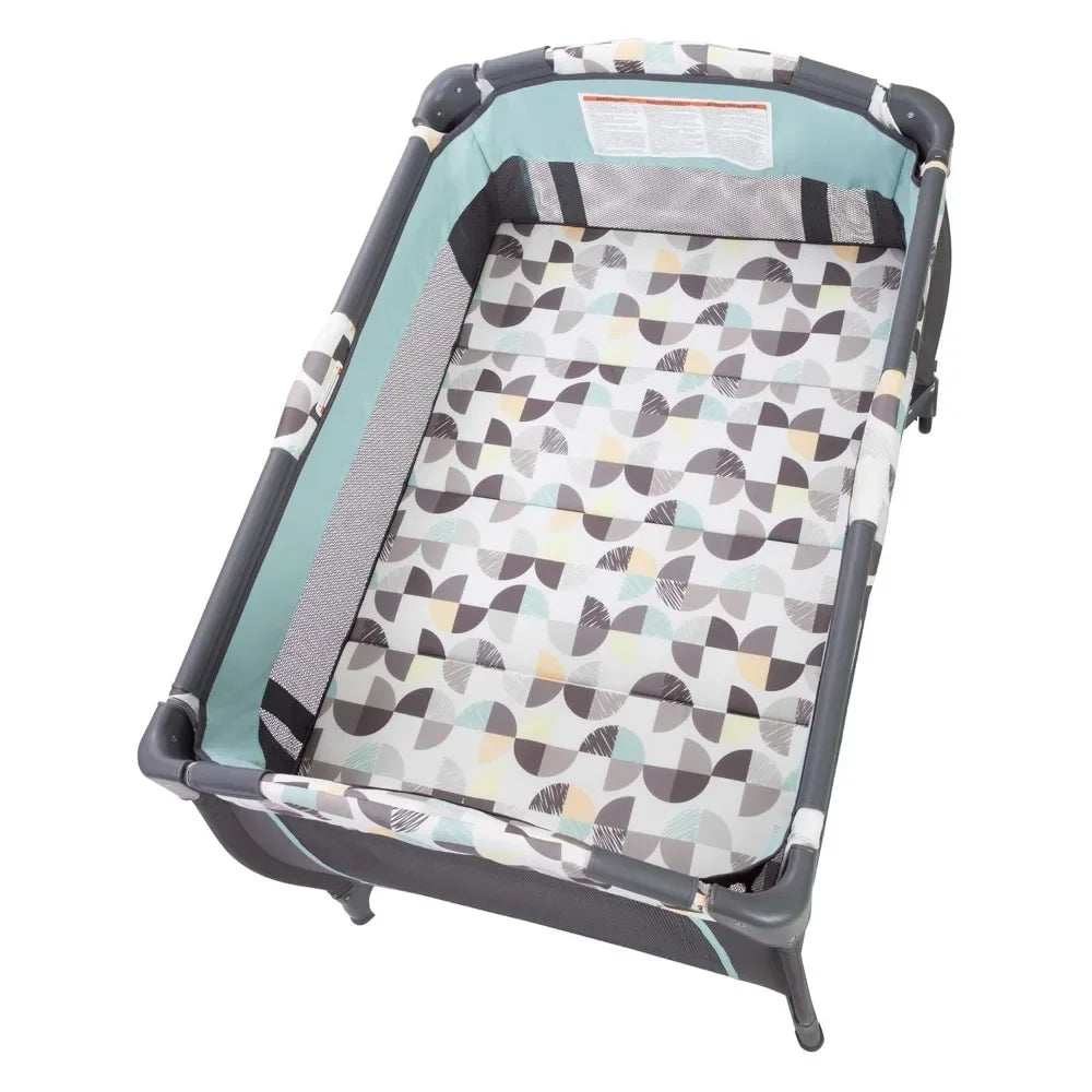 Trend E Portable Compact Newborn Nursery Center Pack and Play Baby Crib with Parent Organizer Bassinet and Travel Bag Doodle Dots